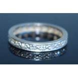 A white metal diamond full hoop eternity ring, comprising twenty-one single cut diamonds in