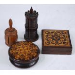 A 19th century rosewood pin case of ringed turned castellated form, having a pull-out cotton section