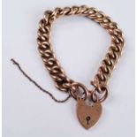 A 9ct rose gold hollow rounded curblink bracelet, with padlock clasp and safety chain, length 210mm,