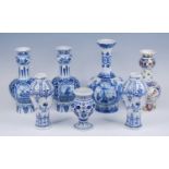 A pair of Royal Mosa blue and white vases, 20th century, the garlic neck above an hexagonal body,