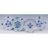 A pair of English blue and white delftware plates, probably Bristol, circa 1730, each decorated with