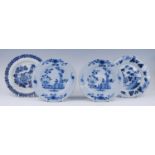 A pair of English blue and white delftware plates, probably London, circa 1750, decorated flowers