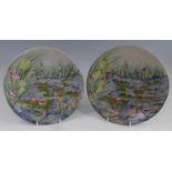 A pair of Cobridge Stoneware plates in the Water Poem pattern, underglaze painted, impressed and