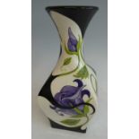 A Black Ryden pottery vase in the Purple Rose pattern, the flared rim over square slightly bulbous