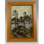 A Cobridge Stoneware framed plaque decorated with pine trees within a river landscape setting,