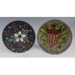 A Cobridge Stoneware plate with floral design, impressed and painted marks, dated 14.7.99 verso,