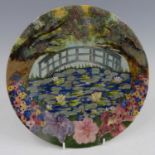 A Cobridge Stoneware year plate for 2005, decorated in the style of Monet, impressed and painted