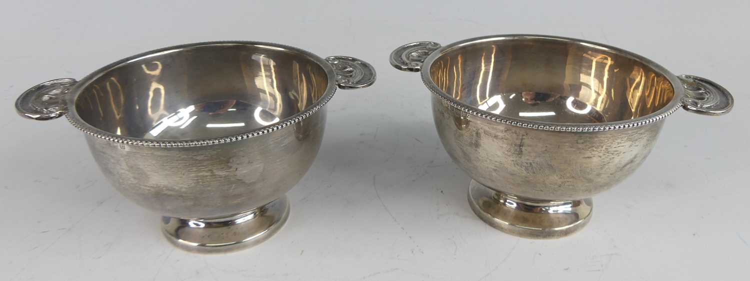 A pair of late Art Deco silver quaichs, each of plain circular form with beaded rims and scallop