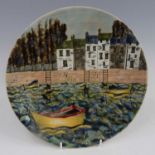 A Cobridge Stoneware year plate for 2004, decorated with fishing boats and houses, impressed and