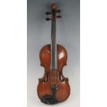 An early 20th century violin, having a one piece maple back with spruce top, maple neck, ebony