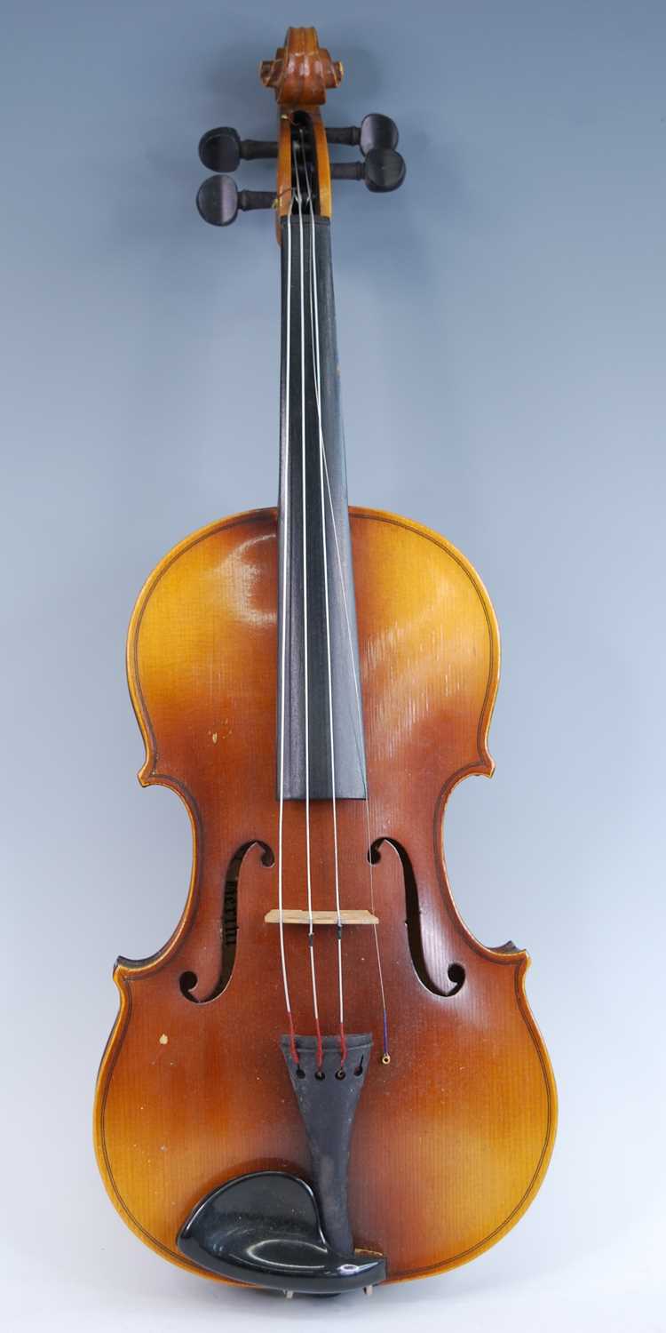 A mid-20th century viola, having a two piece back with spruce top, ebony finger board and pegs,