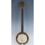 A 20th century French "The Jetel" four string banjo, having an 11 1/4" head with mother of pearl