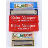 An M. Hohner The Echo Super Vamper harmonica, in original box, together with three M. Hohner Echo