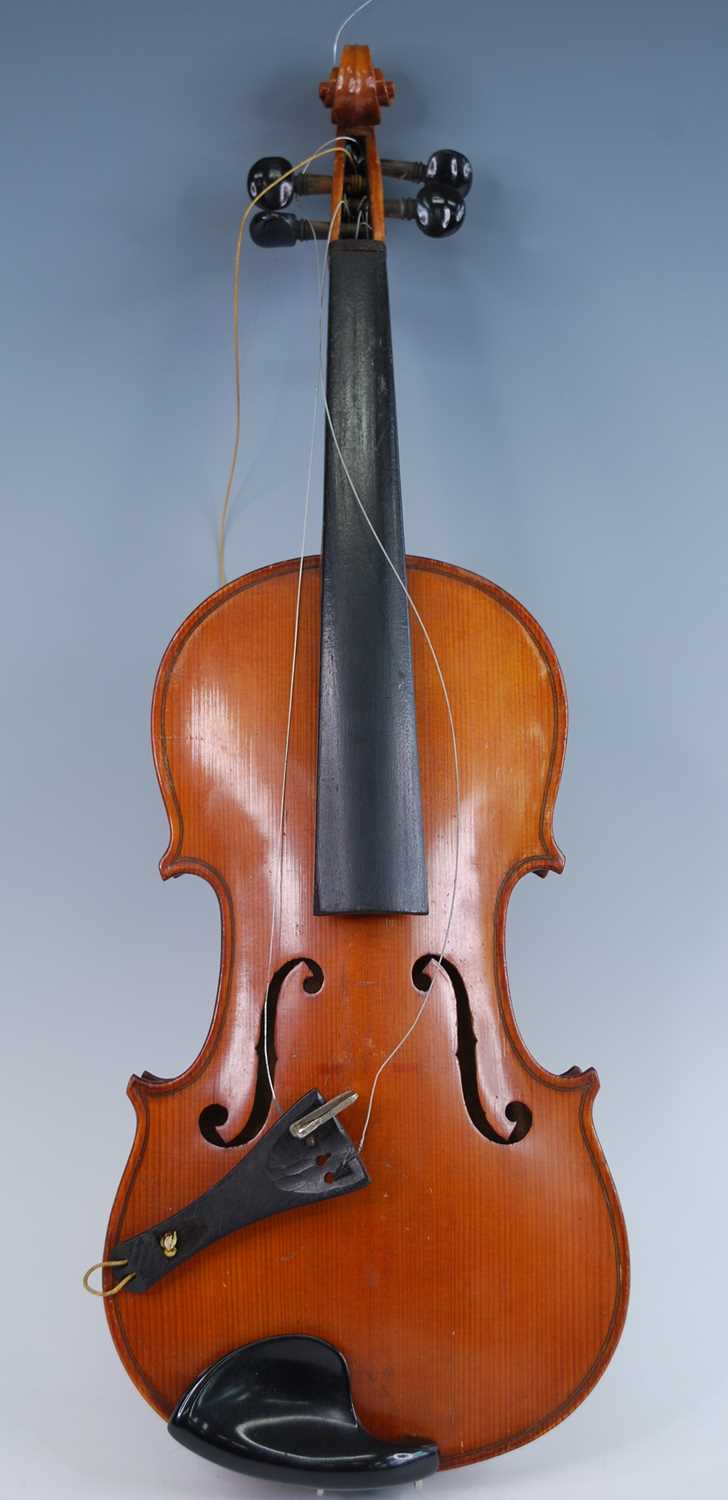 An early 20th century Continental violin, having a two piece maple back and spruce front with