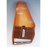 An Oscar Schmidt C Series Autoharp, in carry case with tuning fork and paperwork, together with a