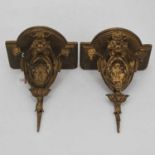 A pair of 19th century gilt gesso wall bracket, each having a bowfront platform on decorative gilt