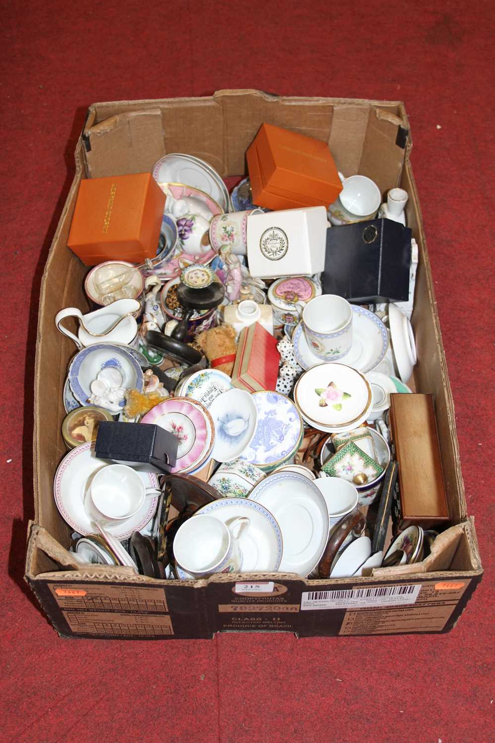 A box of miscellaneous items to include various coffee cans and saucers, blanc de chine figural