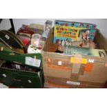 Three boxes of vintage board games, advertising tins and bottles