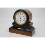 A Victorian walnut and ebonised drum shaped mantel clock having a circular enamel dial with Roman