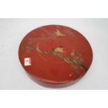 A Japanese Taisho period lacquered box, of circular form and with removable lid, gilt decorated with