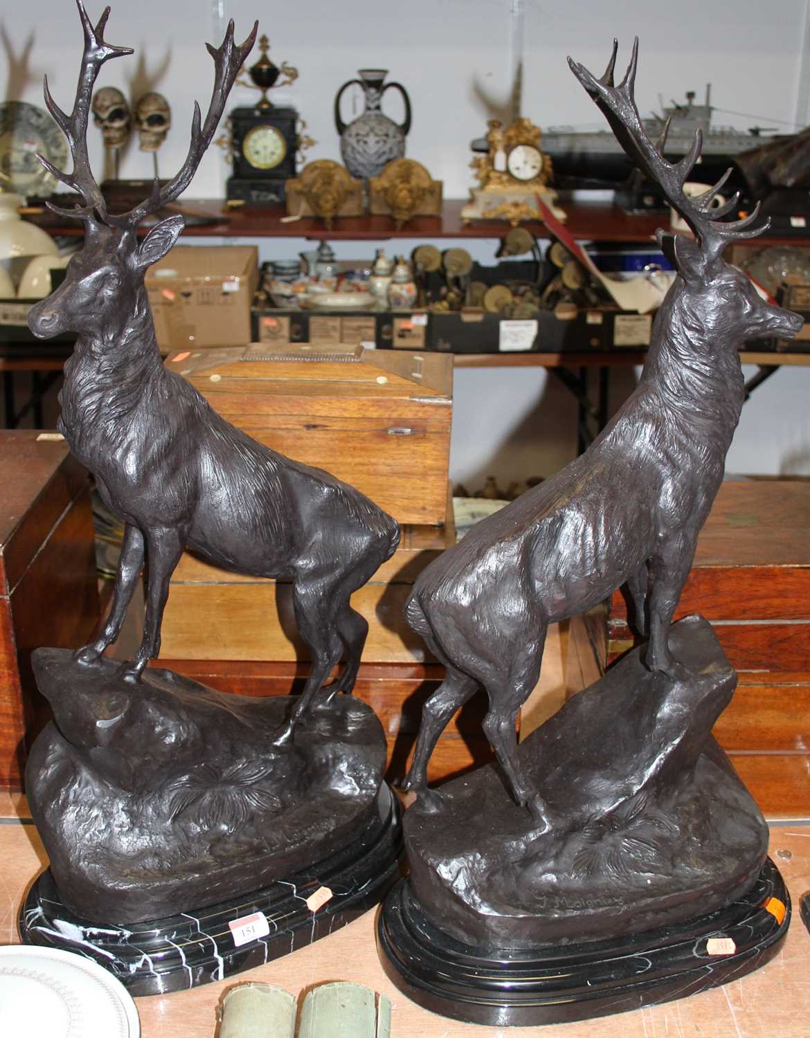 After Jules Moigniez (1835-1894) - a pair of large reproduction bronzed figures of stags modelled in