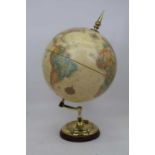 A Replogle Globes Inc terrestrial globe, on a brass base and wooden plinth, height 50cm