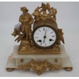 A late 19th century French gilt metal and alabaster mantel clock, the drum shaped clock with