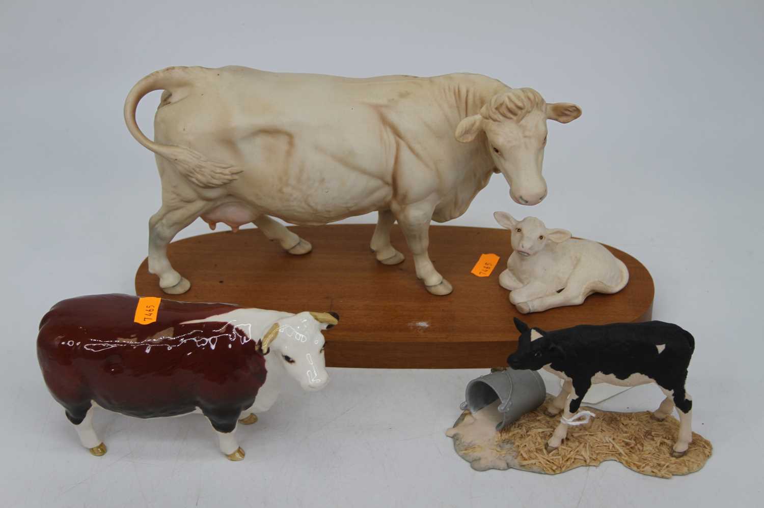 A Beswick model of a cow, Champion of Champions, height 11cm, together with a Border Fine Arts model