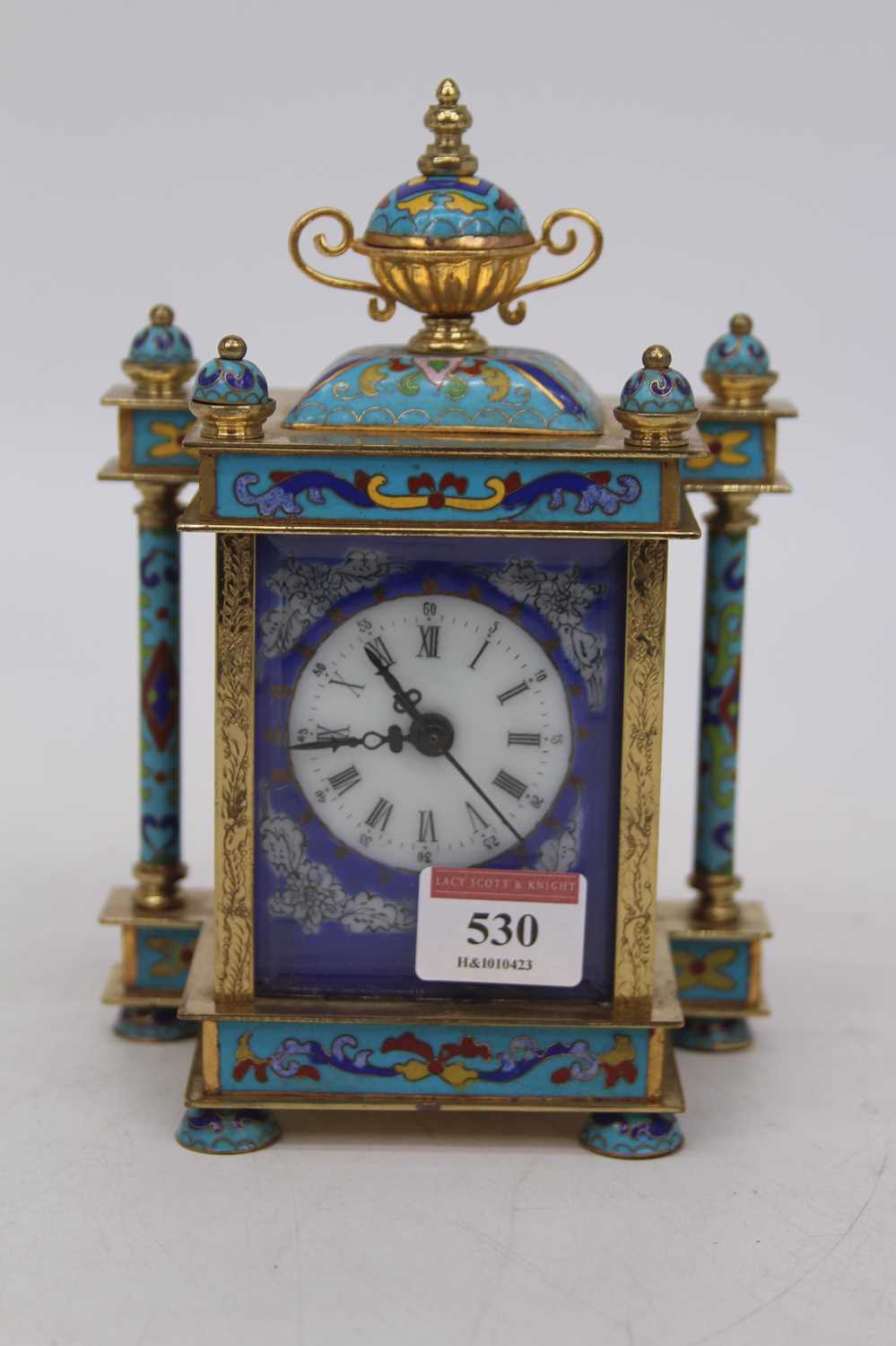 A lacquered brass and cloisonne enamelled timepiece, of architectural form, the dome top