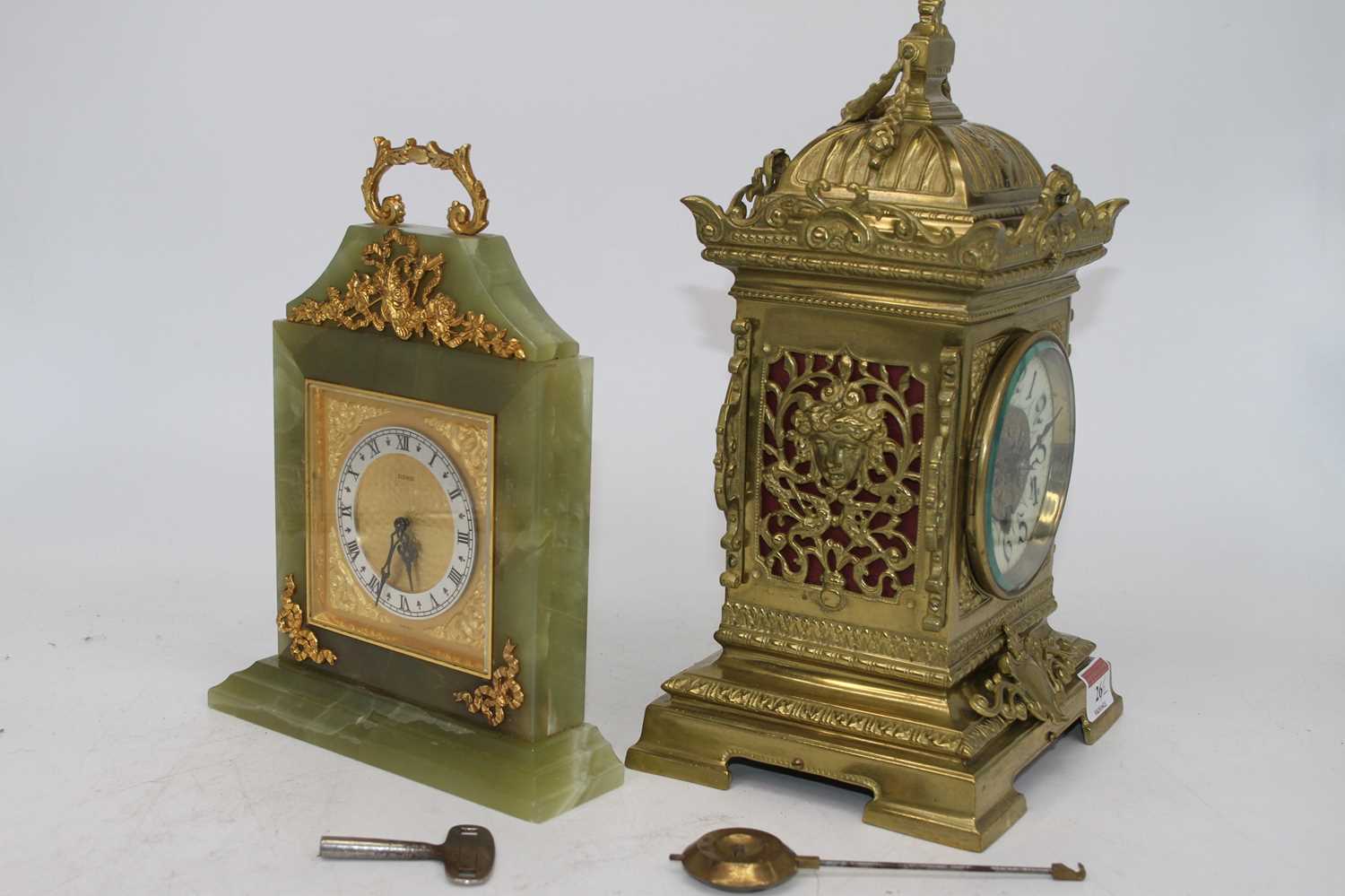 A 19th century brass cased mantel clock having a caddy type top with shell finial, above an - Image 2 of 2