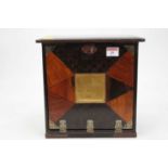 A Japanese Taisho period lacquered and specimen wood table top stationary cabinet, the hinged fall