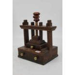 A 19th century Welsh oak table top flower press having adjustable screw top with single drawer