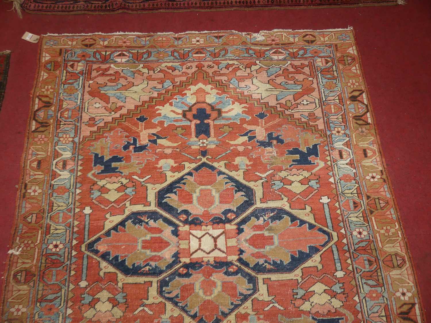 A Persian woollen Heriz red ground rug, the quatraform medallion within stepped spandrels, 190 x - Image 6 of 9