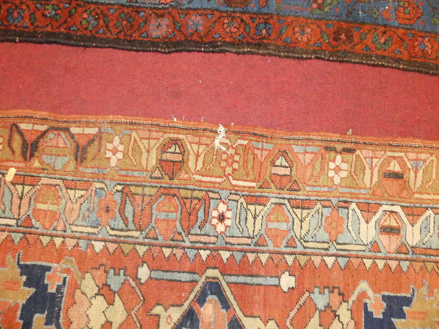 A Persian woollen Heriz red ground rug, the quatraform medallion within stepped spandrels, 190 x - Image 9 of 9
