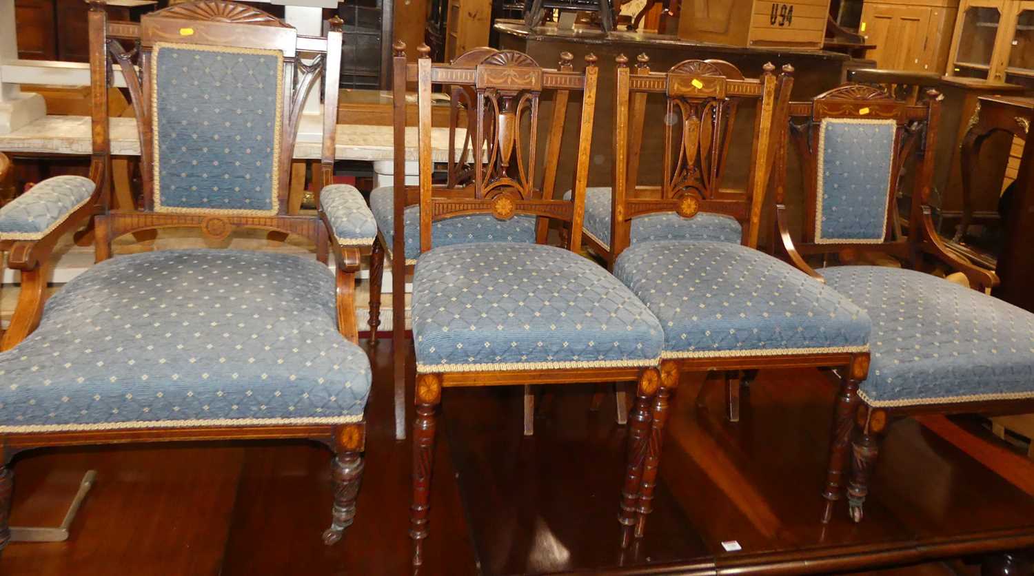 An Edwardian mahogany and floral satinwood inlaid eight-piece salon suite, comprising; lady's and