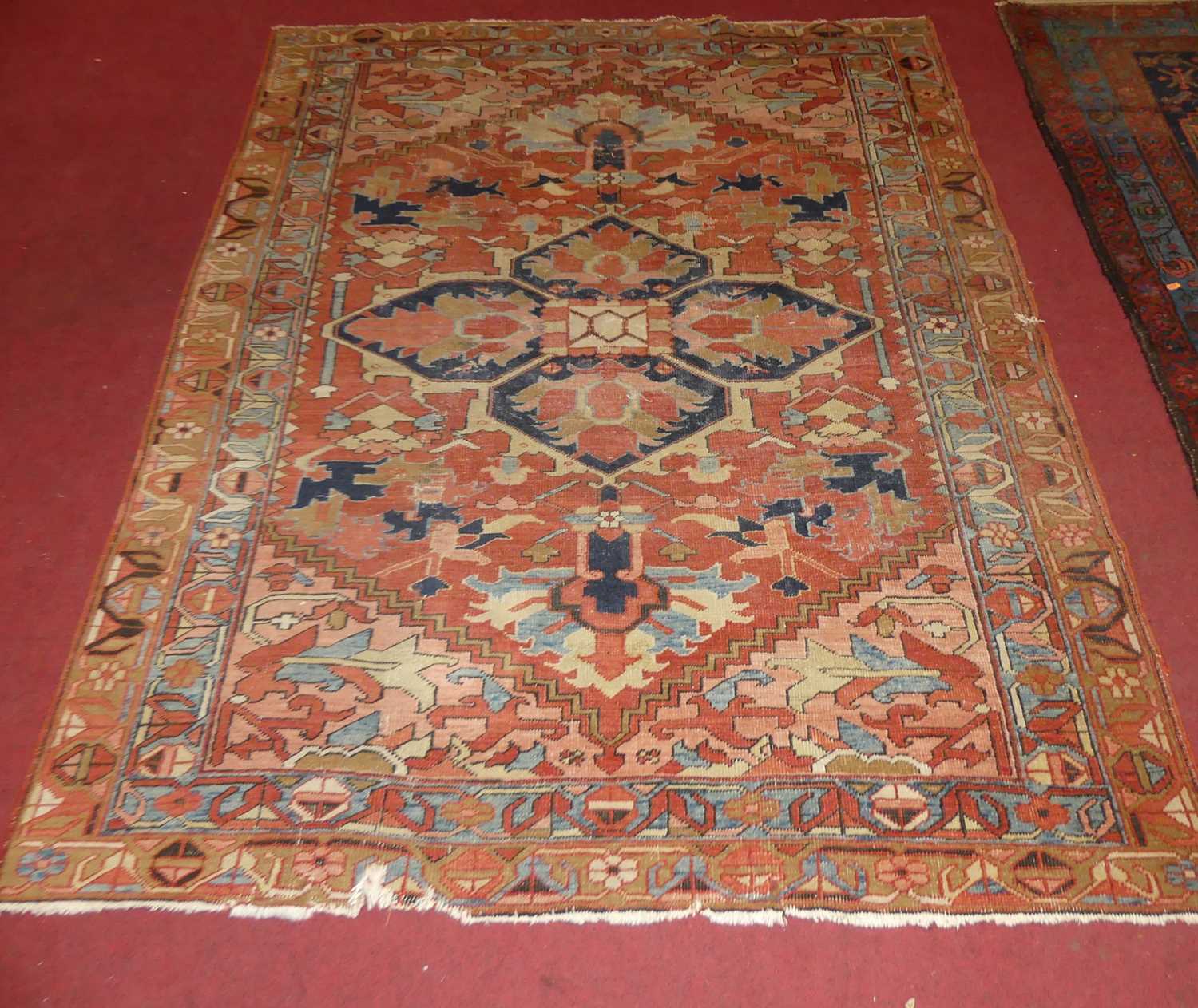 A Persian woollen Heriz red ground rug, the quatraform medallion within stepped spandrels, 190 x - Image 2 of 9