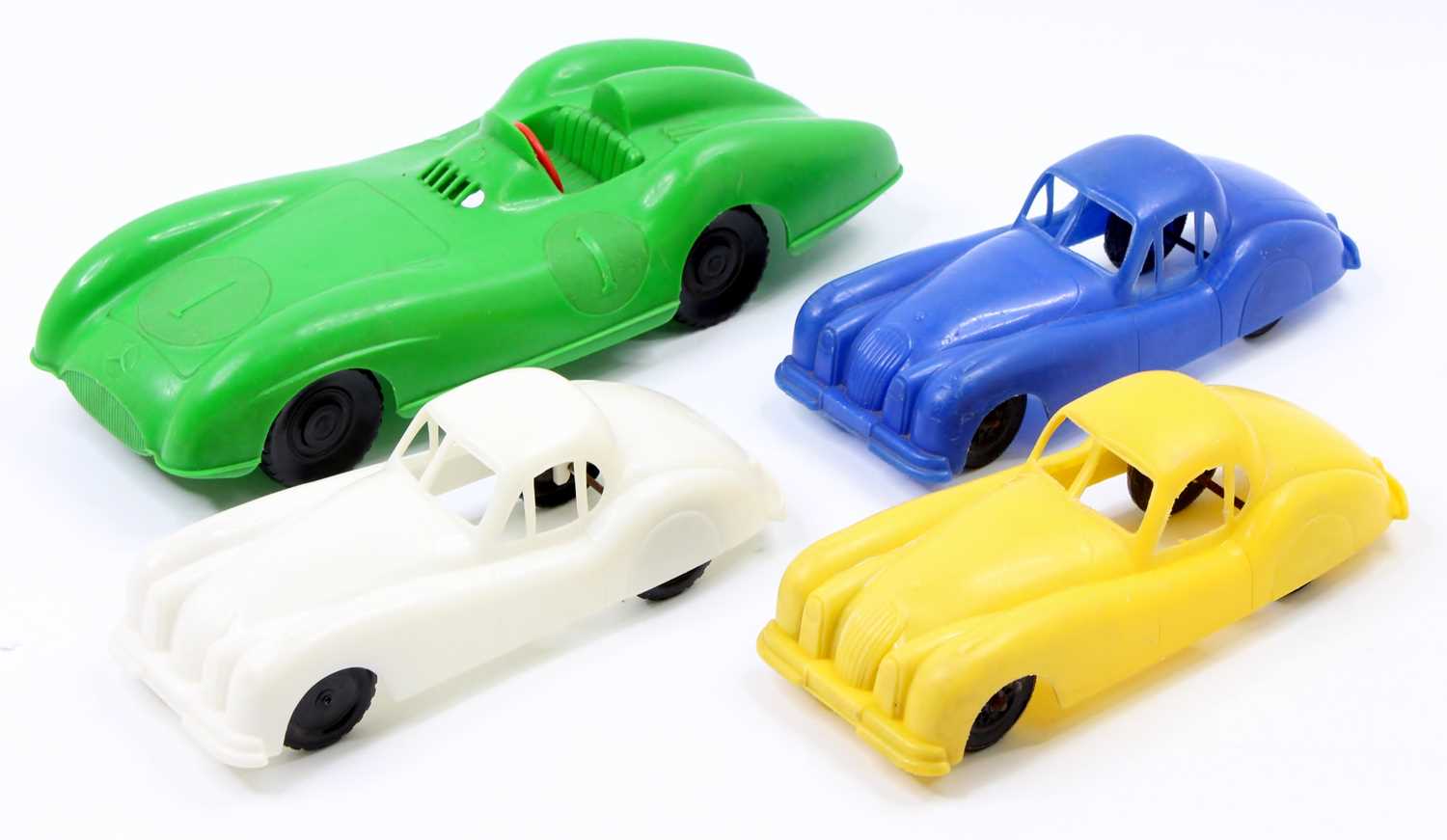 4 various scale plastic racing cars, to include 3 Jaguar XK120s, multiple colours included