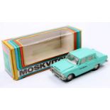 A boxed Russian Diecast 1/43rd scale model of a Moskvitch Taxi in sea green, with a white