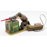 A vintage Japan-manufactured tinplate battery-operated U.S. Army Machine Gunner, with Soldier