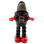 A KO Toys of Japan tinplate and clockwork planet Robbie the Robot, comprising of a black body with