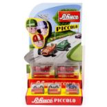 A Schuco Piccolo card retailers shop display stand together with 5 boxed models - No. 702