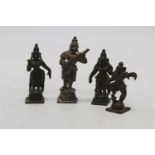 An Indian brass figure of a Deity, h.9cm; together with three others (4)