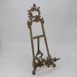 A brass table easel in the Rococo style, having cast C-scroll decoration, h.58cm