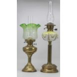A Victorian oil lamp, having a yellow glass font on a brass fluted column and circular base, h.