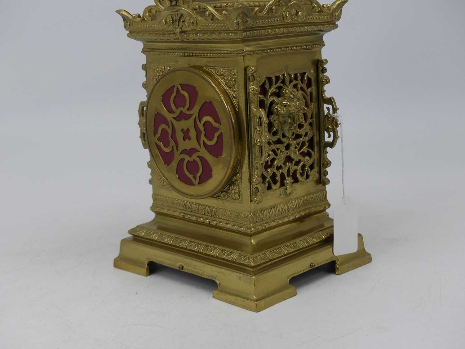 A late 19th century brass cased mantel clock, having a caddy-type top above an enamelled chapter - Image 3 of 4