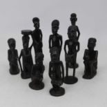 A collection of nine East African (Malindi) souvenir ware figures, each carved as a tribesman or