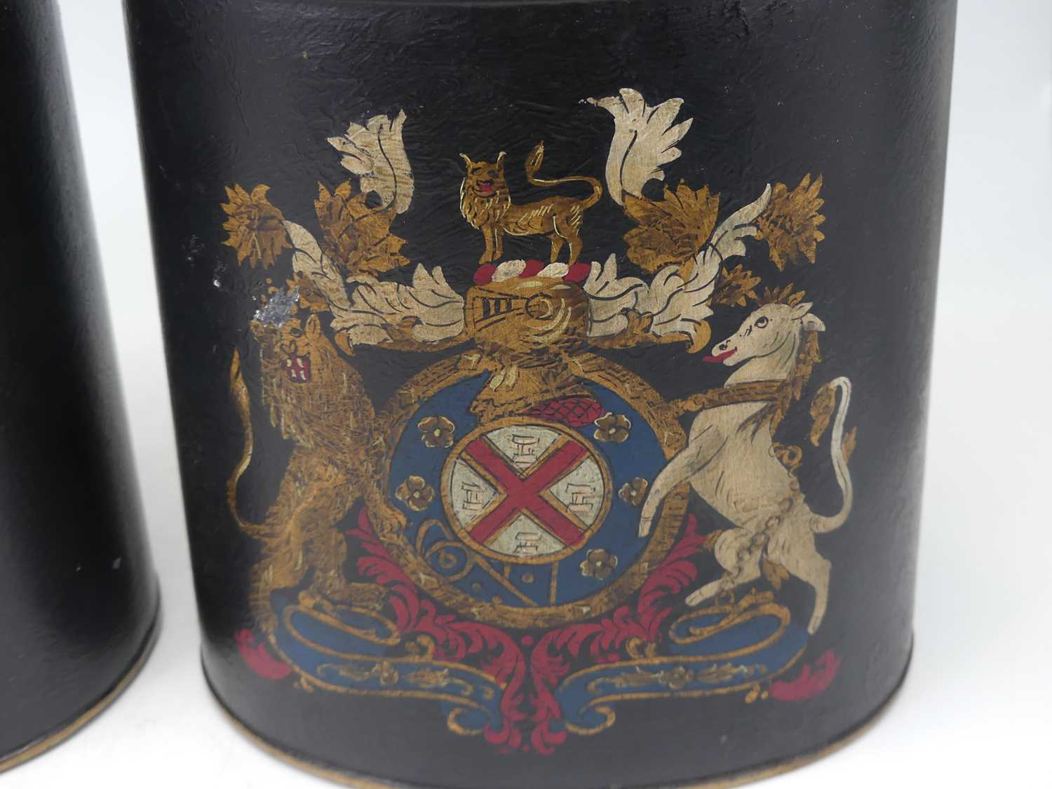 A pair of modern black painted toleware tea canisters, each transfer printed with a royal crest, - Image 2 of 2