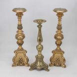 A pair of reproduction gilt resin pricket candle sticks in the ecclesiastical style, height 47cm,