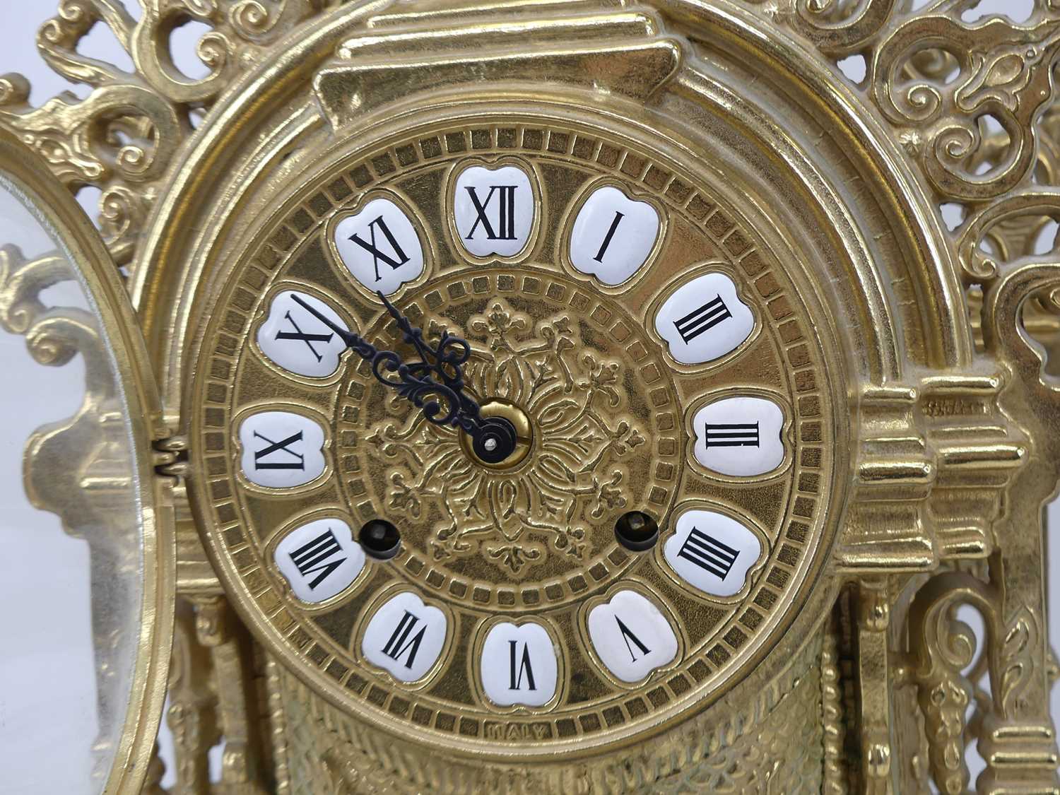 A large 18th century style brass cased mantel clock, the circular dial with raised enamelled plaques - Image 2 of 3