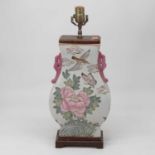 A reproduction Chinese table lamp, of Hu shape, enamel decorated with birds amidst flowers, on a